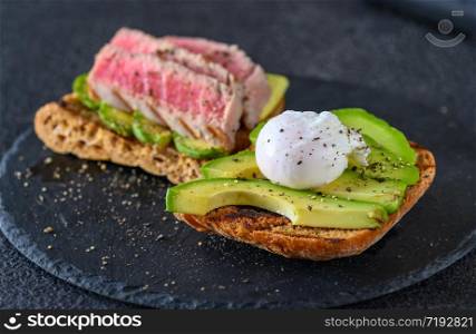 Sandwich with tuna, avocado and poached egg