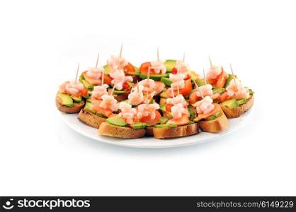 sandwiches garnish with shrimps, avokado and lettuce on plate, snack