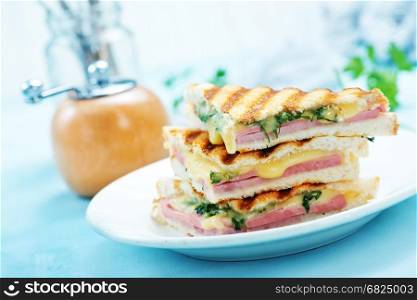 sandwiches on plate and on a table