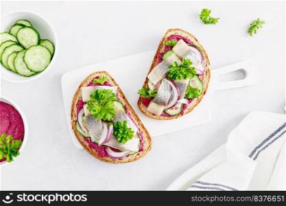 Sandwiches, toasts with salted herring and beetroot pate, top view