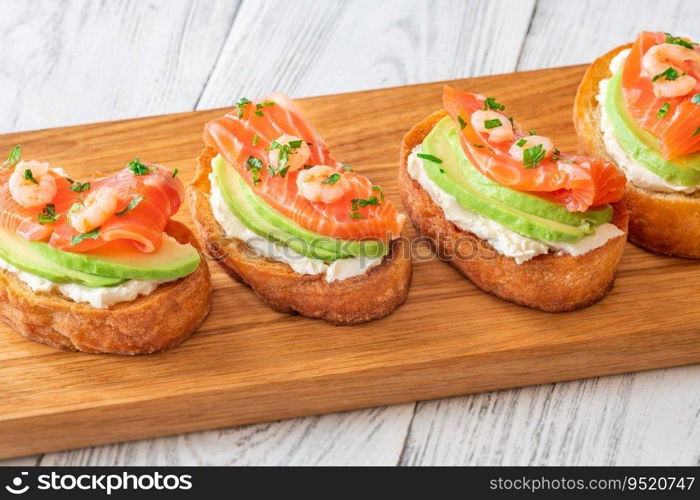 Sandwiches with cream cheese, avocado and salmon