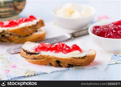 Sandwiches with fresh red currant jam, blue background, selective focus