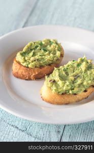 Sandwiches with guacamole on the plate