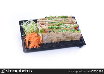 sandwiches with meat and vegetables on plate
