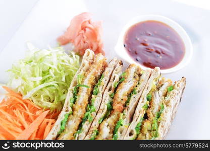 sandwiches with meat and vegetables on plate