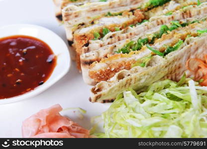 sandwiches with meat and vegetables on plate