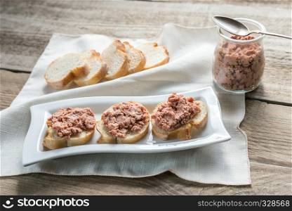 Sandwiches with pate on the wooden board