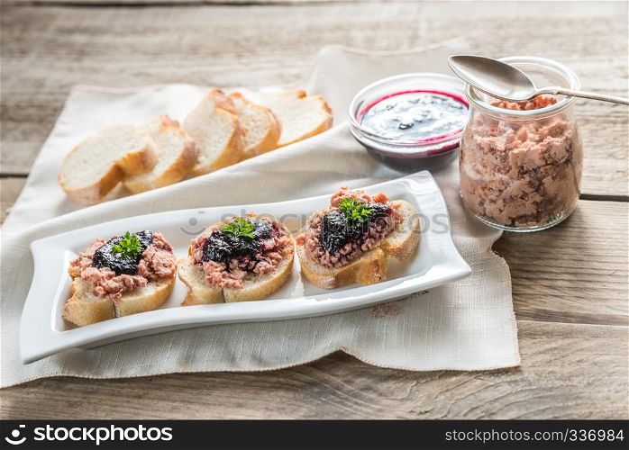 Sandwiches with pate on the wooden board