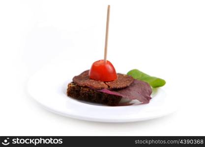 sandwiches with slices meat on wooden chopsticks