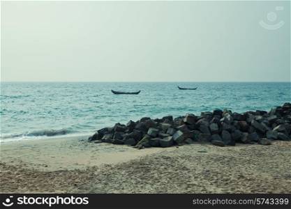 Sandy beach and boat in the sea