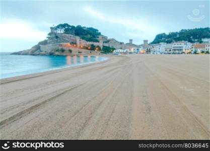 Sandy beach at Tossa de Mar in the early morning in September.. Tossa de Mar Beach. Costa Brava.