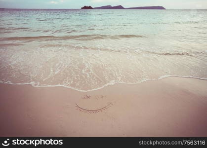 Sandy beach in ocean coast. Travel background.