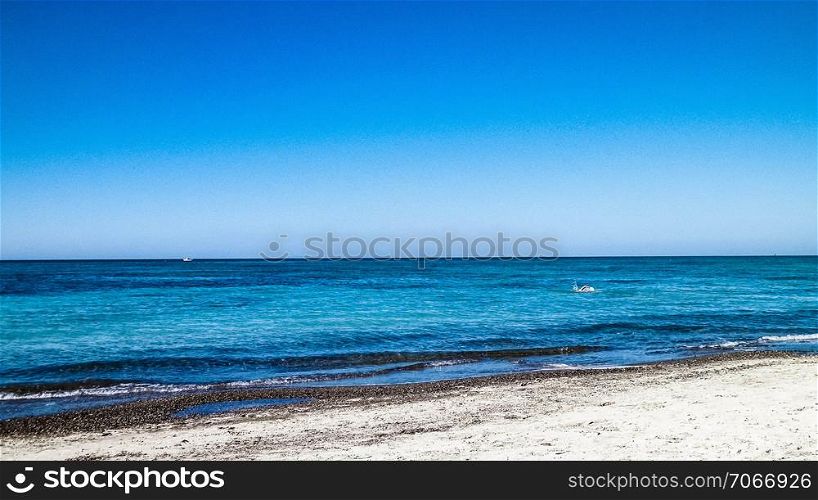 Sandy beach in Vada, transparent, turquoise water and white sand. Travel and nature concept.. Beach in Vada, Italy.