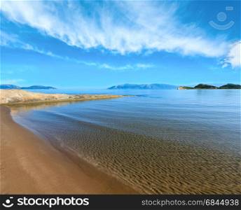 Sandy beach morning landscape (Narta Lagoon, Vlore, Albania). Bllue sky with some clouds.