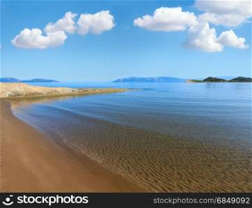 Sandy beach morning landscape (Narta Lagoon, Vlore, Albania). Deep blue sky with some cumulus clouds.