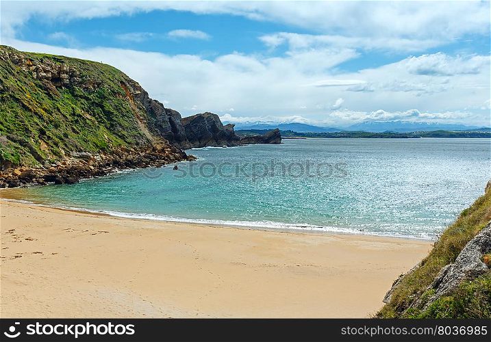 Sandy beach (Spain) Atlantic Ocean coastline landscape.