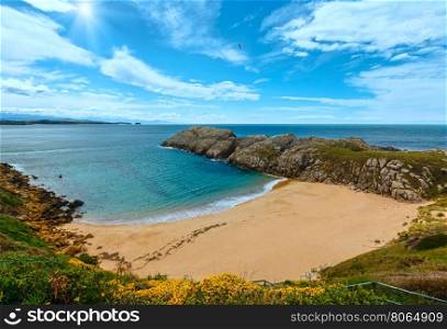 Sandy beach (Spain) Atlantic Ocean sunshiny coastline landscape.