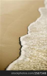 Sandy beach with waves.