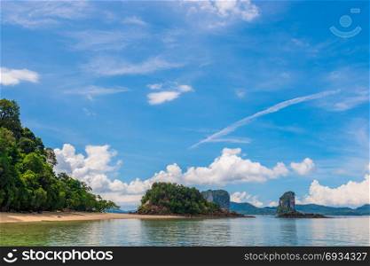 sandy empty beach and beautiful mountains on the horizon, a beautiful view of the Andaman Sea in Thailand