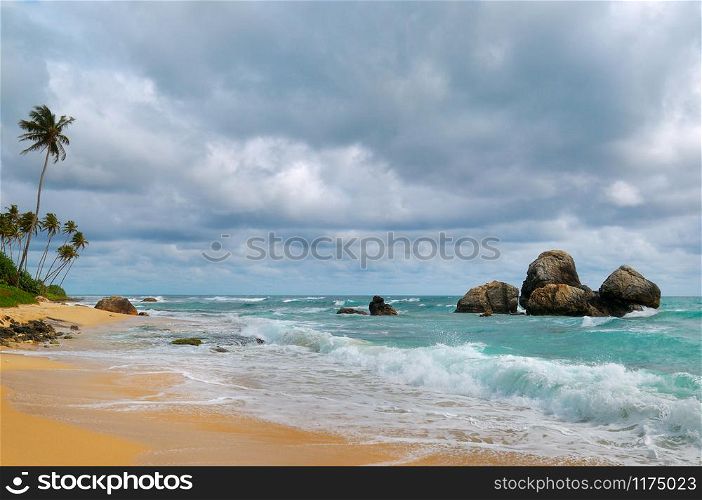 Sandy tropical beach and sky with cumulus rain clouds. The concept is travel.
