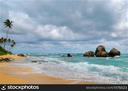 Sandy tropical beach and sky with cumulus rain clouds. The concept is travel.