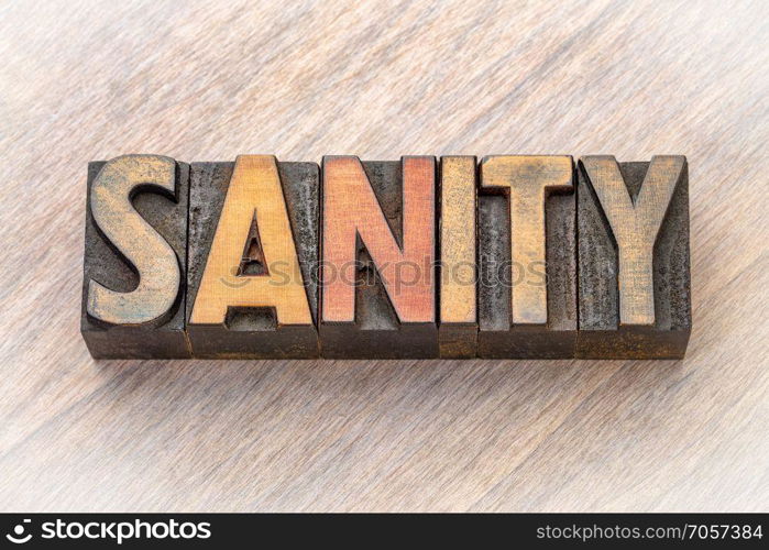 sanity word abstract in vintage wood type. sanity - word abstract in vintage lettepress wood type printing blocks