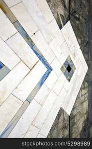 sanpietrini busto arsizio street lombardy italy varese abstract pavement of a curch and marble