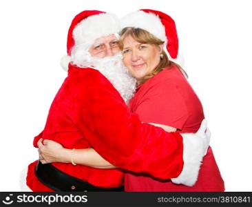 Santa and his wife hugging each other. Isolated on white.