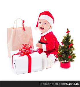 Santa baby girl with gift box and christmas decorations on white