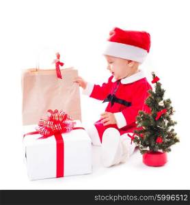 Santa baby girl with gift box and christmas decorations on white. Santa baby girl