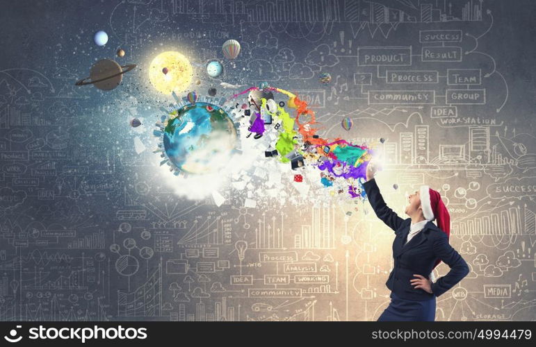 Santa businesswoman with mobile . Woman in suit and Santa hat screaming in mobile phone