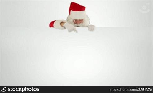Santa Claus appears behind a white sheet with space for text