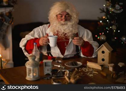 Santa Claus at Home eating cookies and drinking milk