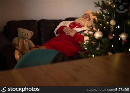 Santa Claus at Home resting on couch