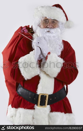 Santa Claus Carrying Sack Filled With Gifts