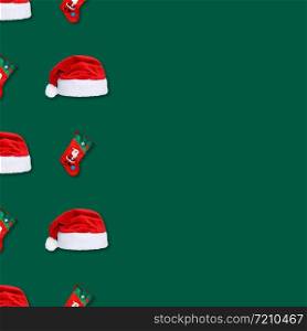 Santa Claus christmas red hat and christmas sock isolated on green background. Christmas seamless pattern. Copy space.