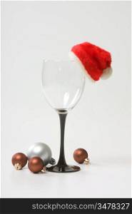 Santa Claus hat on the empty glass