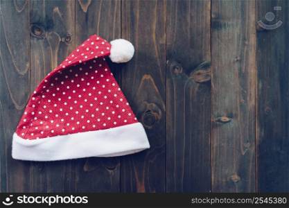 Santa claus hat on wood background with copy space