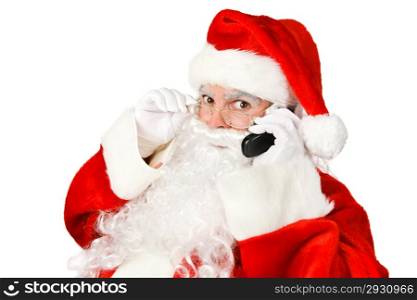Santa Claus having a telephone conversation. Isolated on white.