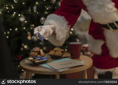 santa claus having christmas cookies . Resolution and high quality beautiful photo. santa claus having christmas cookies . High quality and resolution beautiful photo concept