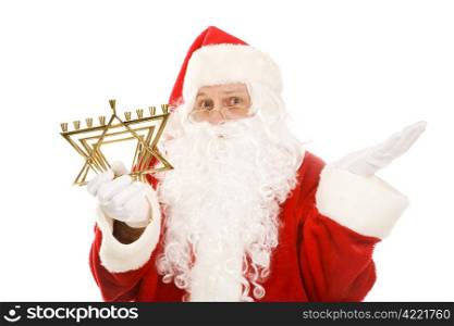 Santa Claus holding a Jewish menorah and looking confused. Isolated on white.