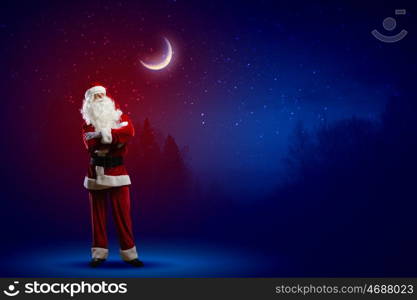 Santa Claus. Image of Santa Claus against night sky background