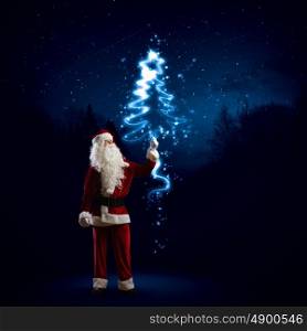 Santa Claus. Image of Santa Claus in red costume with christmas tree