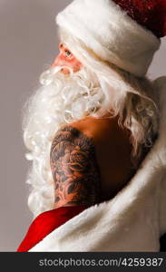 santa claus is dressing up on gray background