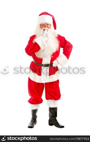 Santa - Claus looks Intently Through his Glasses Directly at the Camera and ?alls for Silence with his Finger to his Lips on a White Background