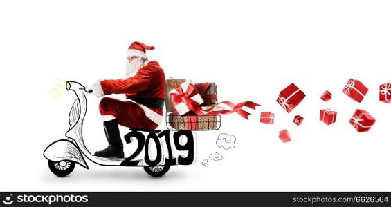 Santa Claus on scooter delivering Christmas or New Year 2019 gifts at white background. Santa Claus on scooter