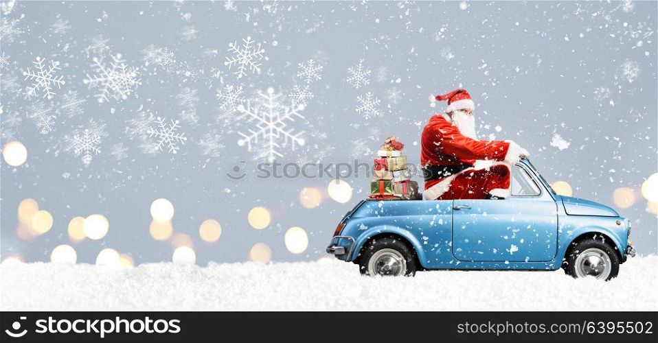 Santa Claus on scooter. Santa Claus on scooter delivering Christmas or New Year gifts at snowy blue background