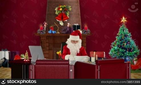 Santa Claus reading letters, office with Christmas decorations