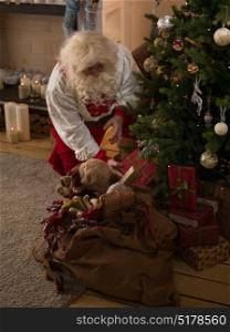 Santa Claus Resting at Home near Christmas Tree