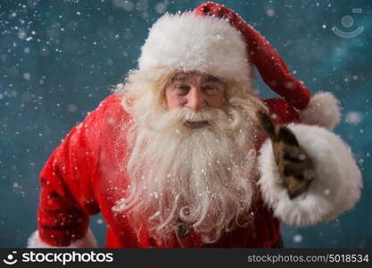 Santa Claus running outdoors at North Pole. Trying to be in time working on delivery gifts to children